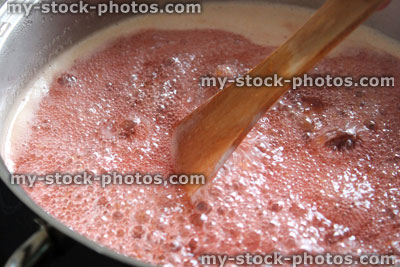 Stock image of jam making, boiling plum and strawberry jam, saucepan