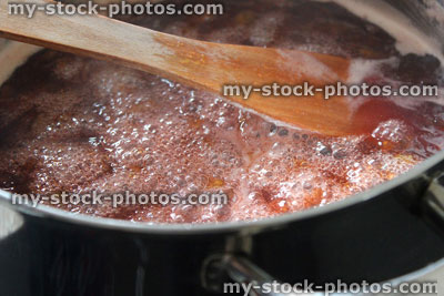 Stock image of jam making, boiling plum and strawberry jam, saucepan