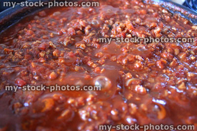 Stock image of bolognese sauce simmering on cooker, beef mince, pasta sauce