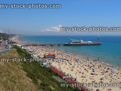 Stock image of Bournemouth beach in summer with sunbathers, seafront, cliffs