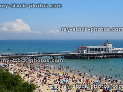 Stock image of Bournemouth beach and seafront with summer holidaymakers, pier