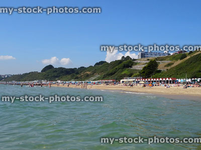 Stock image of Bournemouth coastline, beach huts and cliffs from sea