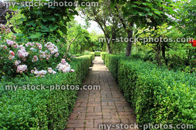 Stock image of old red brick pathway, formal ornamental vegetable garden