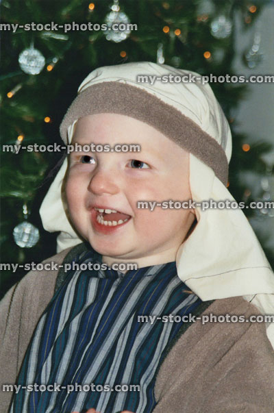 Stock image of young boy dressed as shepherd, Christmas Nativity play