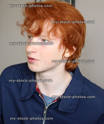 Stock image of teenage boy with blue jacket, red hair, talking, conversation