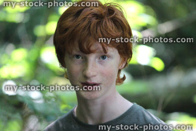 Stock image of boy, boy's face smiling and laughing, red hair