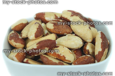Stock image of brazil nuts in dish, healthy snack foods, vitamin E, selenium