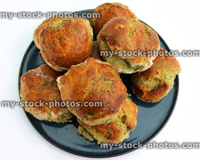 Stock image of freshly baked spinach and wholemeal bread rolls (close up)