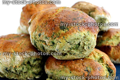 Stock image of freshly baked spinach and wholemeal bread rolls (close up)