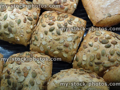 Stock image of square granary bread rolls with sunflower seeds / sliced-almonds