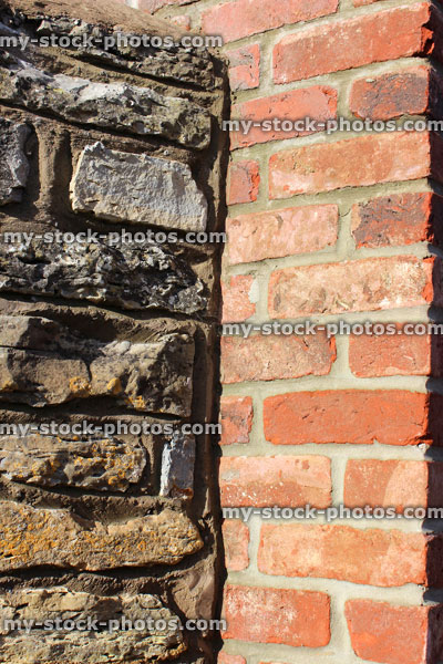 Stock image of formal red brick gate post, contrasting old cobblestone wall