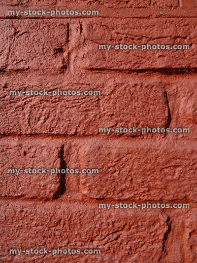 Stock image of brick wall painted over with red terracotta paint