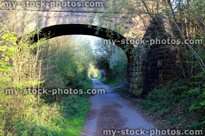 Stock image of bridge over cycle track running beside disused railway line