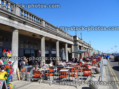 Stock image of Brighton beach cafes / al-fresco dining by pier promenade