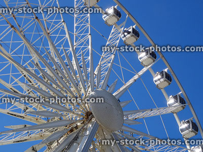 Stock image of white big wheel tourist attraction isolated on blue