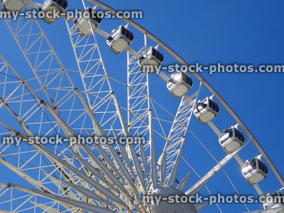 Stock image of large Ferris wheel tourist attraction isolated on blue