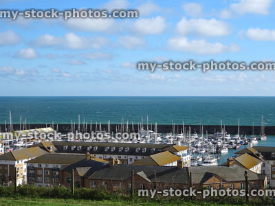 Stock image of Brighton marina, with yachts / boats, seafront apartments / flats