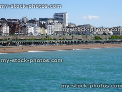 Stock image of Brighton beach in summer with sand, sea and-sunbathers