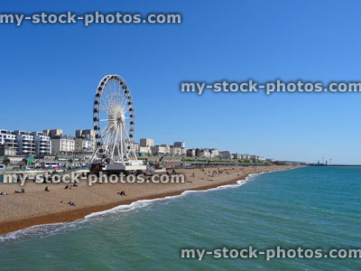 Stock image of Brighton beach with Big Wheel, grand hotels, blue-sky