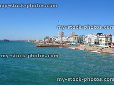 Stock image of Brighton beach, sea and sky, with grand Victorian-hotels