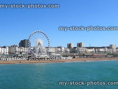 Stock image of Brighton Wheel, beach and town hotels on coastline