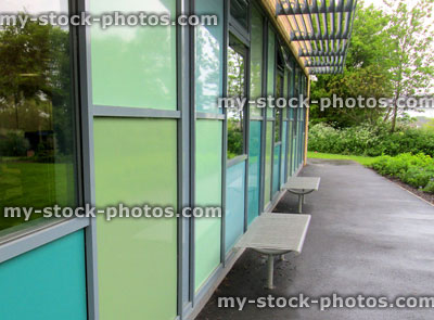 Stock image of public building with green panels cladding the wall
