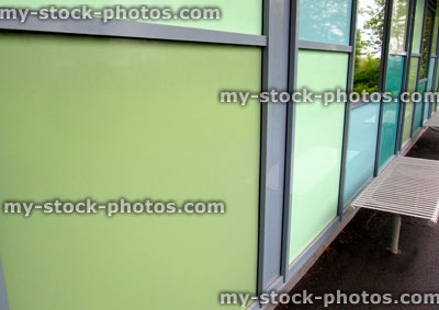 Stock image of public building with green panels cladding the wall