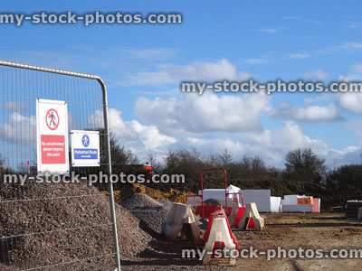 Stock image of construction / building site with metal fence, gravel aggregate