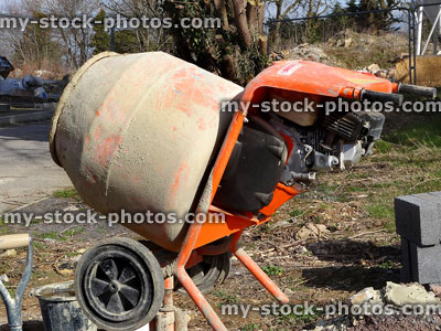 Stock image of electric concrete mixer on building site with cement