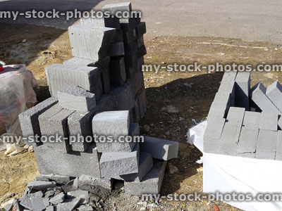 Stock image of grey lightweight aggregate blocks, concrete bricks at building site