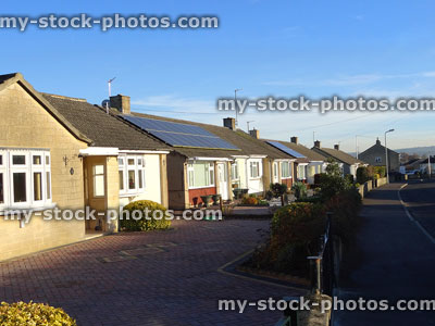Stock image of senior pensioner houses, single storey bungalows, pavement and road