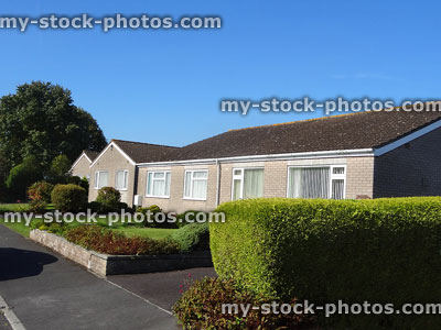 Stock image of terraced single-storey bungalows on elderly housing estate / seniors
