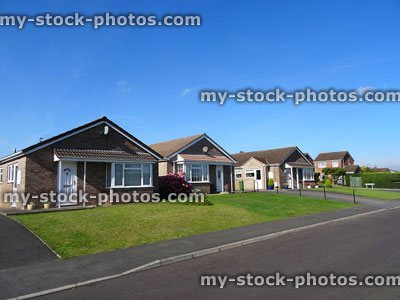 Stock image of single-storey houses and bungalows on modern housing estate