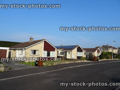 Stock image of row of bungalows, single storey houses in cul de sac, pensioner homes