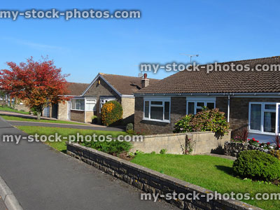 Stock image of affordable, single-storey housing for seniors, bungalows on cul-de-sac