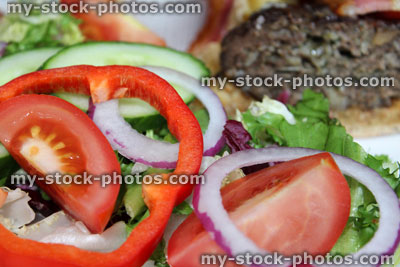 Stock image of homemade gourmet beef burger, cheese burger, stilton cheese, bacon, salad