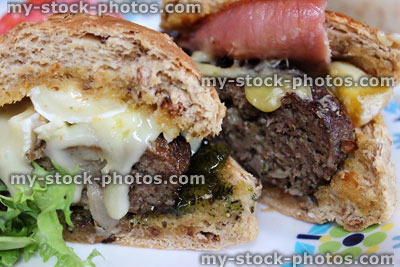Stock image of homemade gourmet beef burgers, cheese burger, stilton cheese, brie, bacon
