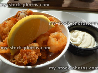 Stock image of deep fried calamari rings / battered squid with garlic mayonnaise
