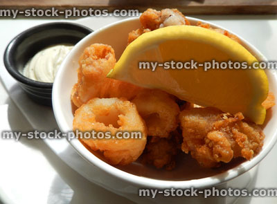 Stock image of deep fried calamari rings / battered squid with garlic mayonnaise