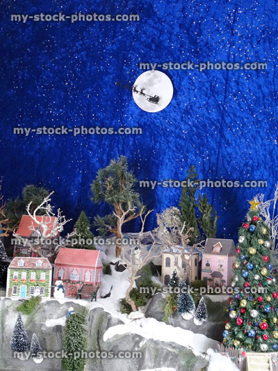 Stock image of Christmas village with homemade miniature cut out paper houses