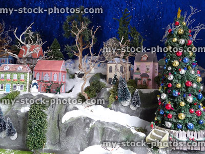 Stock image of model village with Christmas tree and printed card houses