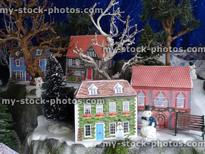 Stock image of Christmas village miniatures with model printable houses / homemade snowmen
