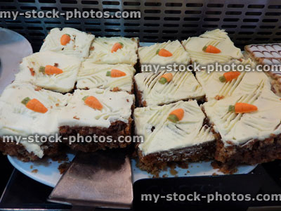 Stock image of carrot cake slices, indulgent dessert, pudding, icing, cream cheese