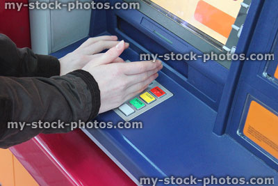 Stock image of PIN number entered / hidden on cashpoint , cash machine fraud