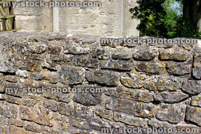 Stock image of rustic cobblestone wall, with pointed irregular stones