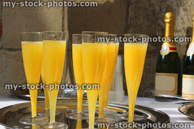 Stock image of silver tray of champagne glasses, orange juice / bucks fizz, wedding reception