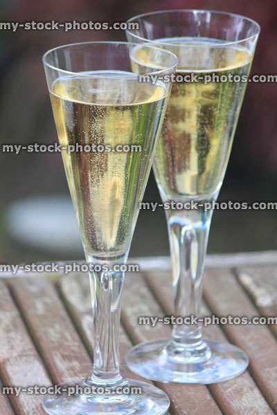 Stock image of stylish champagne flutes / sparkling wine glasses at wedding reception