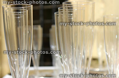 Stock image of empty plastic champagne flutes / wine glasses at wedding reception