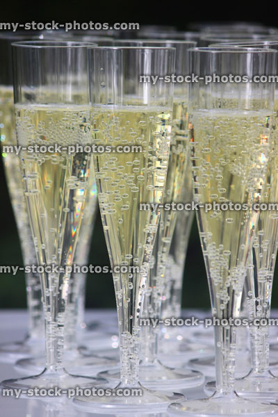 Stock image of plastic champagne flutes / sparkling wine glasses at wedding reception