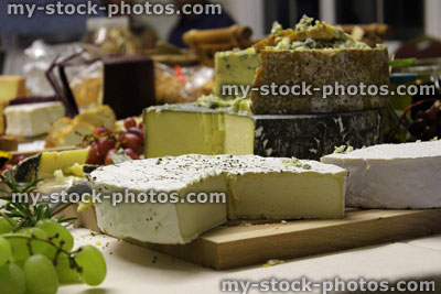 Stock image of luxury cheese board with brie, Stilton, Cornish Yarg, Cheddar